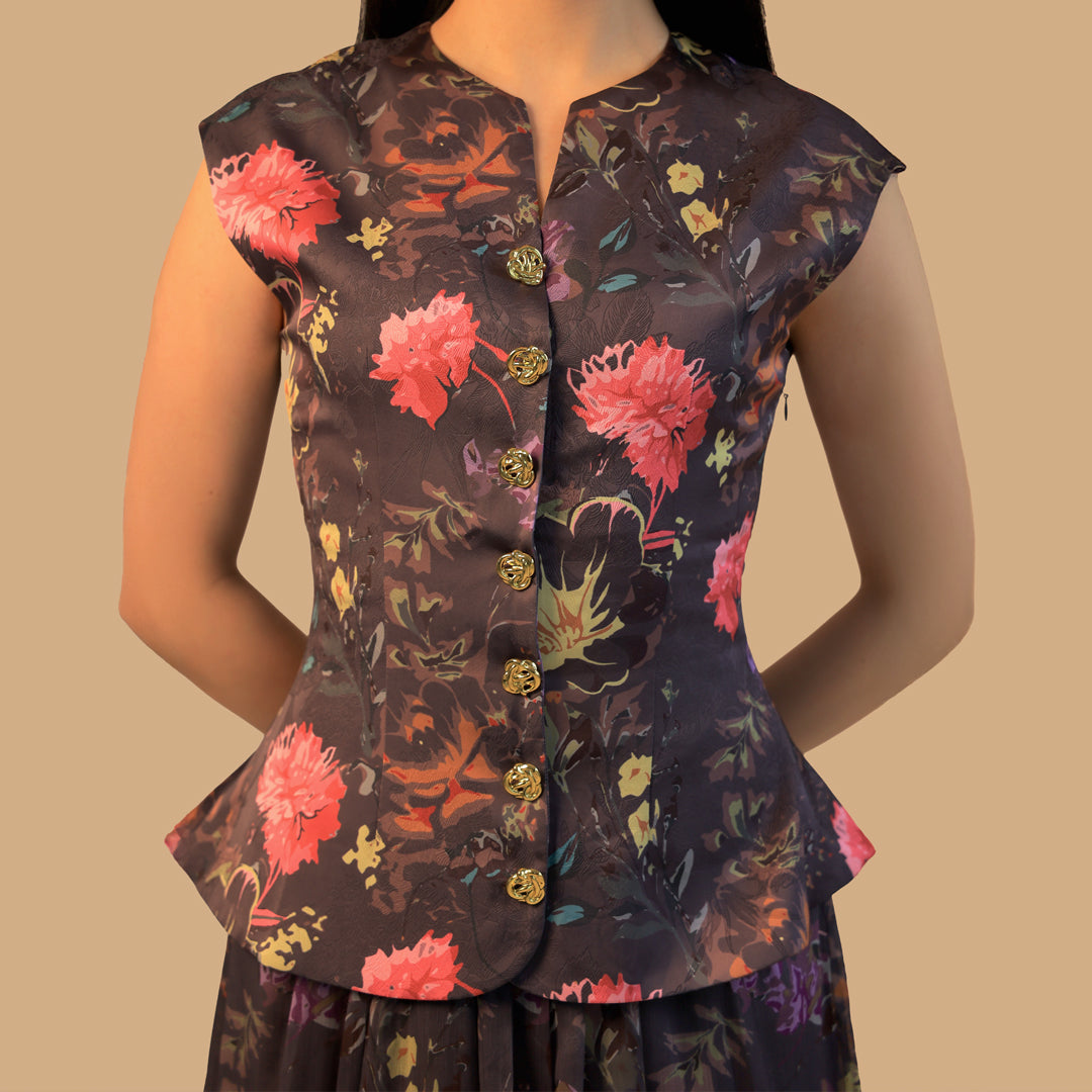 Floral patterned dress with gold buttons on a neutral background