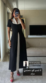 فستان كريب أسود فاخر بياقة هالتر ولمسات ساتان منقط