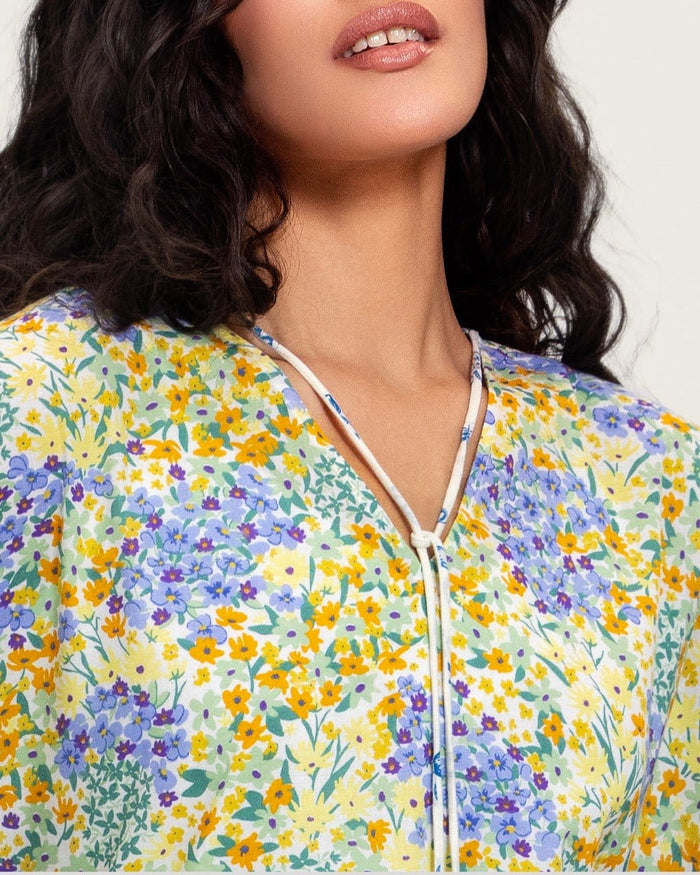 A flowy cotton kaftan with ruffle wide sleeves and pastel print
