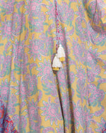Printed Flowy Kaftan Dress with Soft Multicolor Motifs and Tassels - Noētic